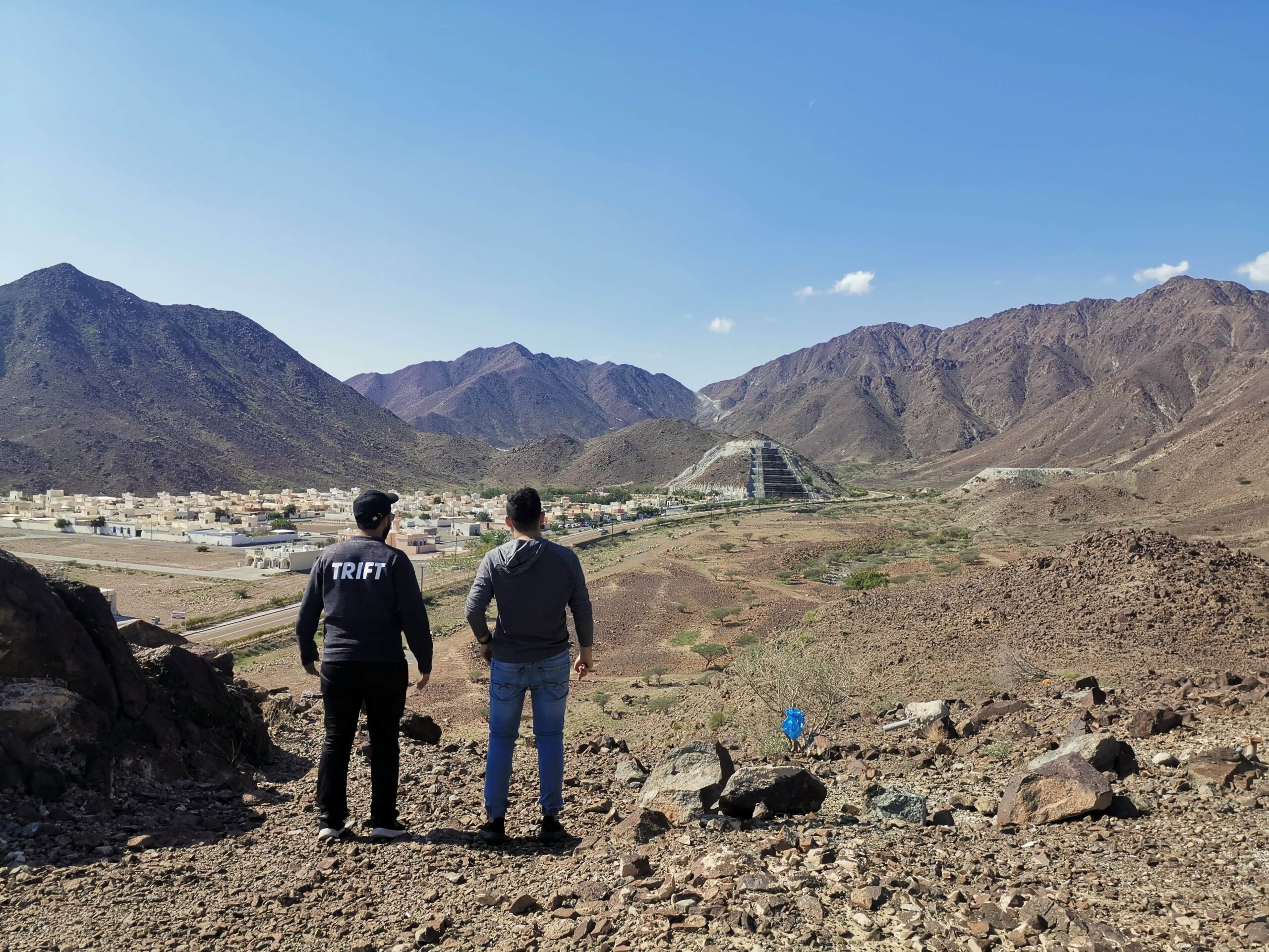 Two men posing at Hiltop Restaurant Madha Oman